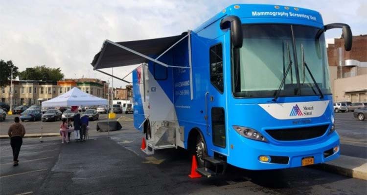Mount Sinai Mamography Screening Unit Bus set up in a parking lot